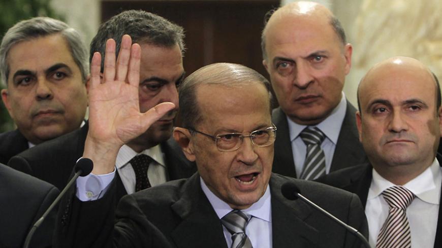 Lebanese oppositon Christian leader and head of the Free Patriotic Movement Michel Aoun (C), accompanied with his parliamentary bloc, speaks during a news conference, after meeting Lebanon's President Michel Suleiman at the presidential palace in Baabda, near Beirut, during the start of the two-day parliamentary consultations to choose a new prime minister, January 24, 2011.  Lebanese caretaker Prime Minister Saad al-Hariri said Monday he will not take part in a government lead by Hezbollah and its allies. 
