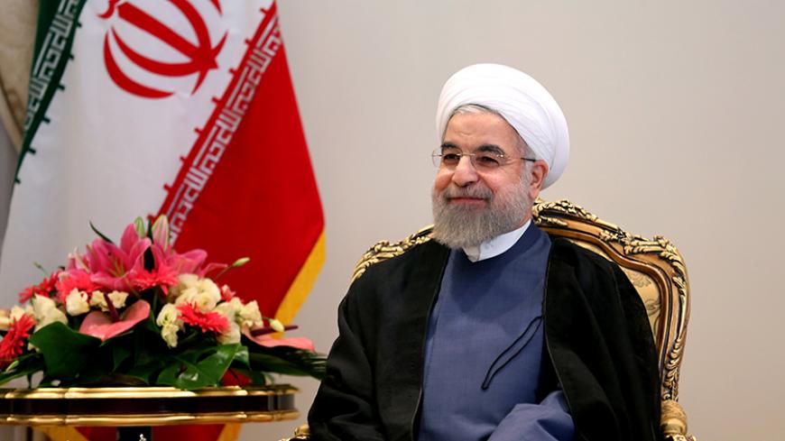 Iranian President Hassan Rouhani smiles during a meeting with German Economy and Energy Minister Sigmar Gabriel (unseen) in Tehran on July 20, 2015. Gabriel flew to Iran, becoming the first top Western official to visit the country since world powers and Tehran reached a historic nuclear deal. AFP PHOTO / ATTA KENARE        (Photo credit should read ATTA KENARE/AFP/Getty Images)