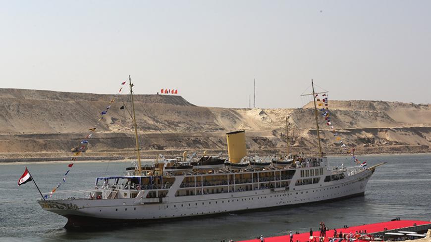 SUEZ, EGYPT - AUGUST 06:  The Mahrousa pulls away from the dock at during the opening ceremony of the new Suez Canal expansion including a new 35km (22 mile) channel on August 6, 2015 in Suez, Egypt. The new channel of the Suez Canal was finished in a year at a cost of 8 billion USD and is designed to increase the speed and capacity of ships.  The new branch is being celebrated as a major nationalist project. (Photo by David Degner/Getty Images).