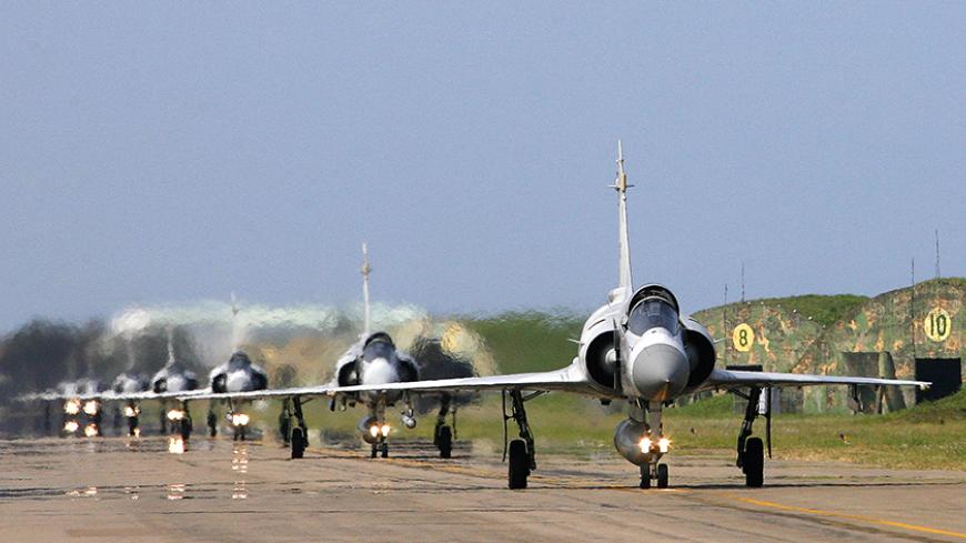 A group of Mirage fighter planes prepare to take off during a visit to the air force 499th wing as part of a model unit's tour organised by the Taiwan Ministry of National Defense, in Hsinchu, August 29, 2008.  REUTERS/Nicky Loh  (TAIWAN) - RTR21SWA