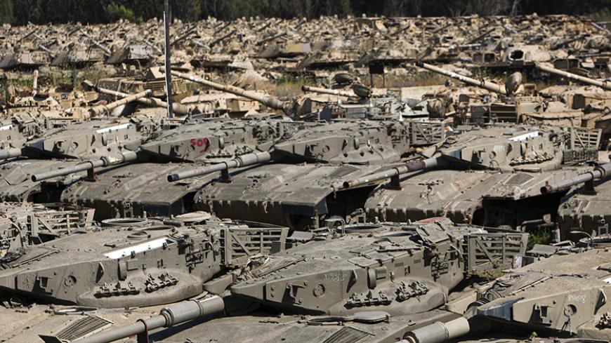 Old Israeli tanks lie in an armoured vehicle "graveyard" at an Israeli army base near the southern town of Kiryat Gat May 8, 2011. The field contains some 700 decommissioned armour the Israeli military uses in training exercises and for parts and scrap. REUTERS/Amir Cohen (ISRAEL - Tags: SOCIETY MILITARY) - RTR2M5HL