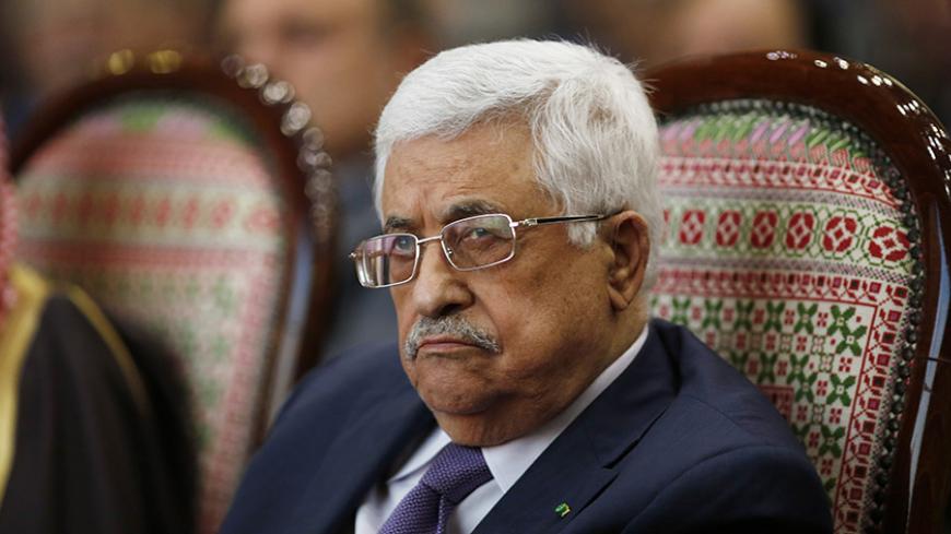 Palestinian President Mahmoud Abbas attends the opening ceremony of the "Jerusalem in Memory" exhibition in the West Bank city of Ramallah January 4, 2015. Abbas said on Sunday he was discussing with Jordan plans to resubmit to the United Nations Security Council a resolution calling for the establishment of a Palestinian state that failed to win enough votes on December 31. REUTERS/Mohamad Torokman (WEST BANK - Tags: POLITICS SOCIETY) - RTR4K199