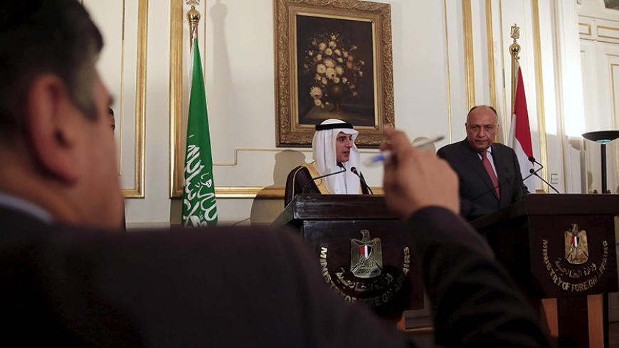 Egypt's Foreign Minister Sameh Shukri (R) and his Saudi Arabian counterpart Adel al-Jubeir listen to a journalist's question during a news conference at the foreign affairs headquarters in Cairo, Egypt May 31, 2015. REUTERS/Amr Abdallah Dalsh - RTR4Y7WP