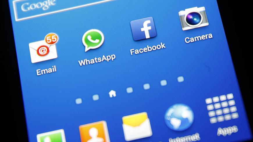 Whatsapp and Facebook icons are seen on a Samsung Galaxy S4 phone in the central Bosnian town of Zenica, February 20, 2014. Facebook Inc will buy fast-growing mobile-messaging startup WhatsApp for $19 billion in cash and stock in a landmark deal that places the world's largest social network closer to the heart of mobile communications and may bring younger users into the fold. REUTERS/Dado Ruvic (BOSNIA AND HERZEGOVINA - Tags: BUSINESS) - RTX196EE