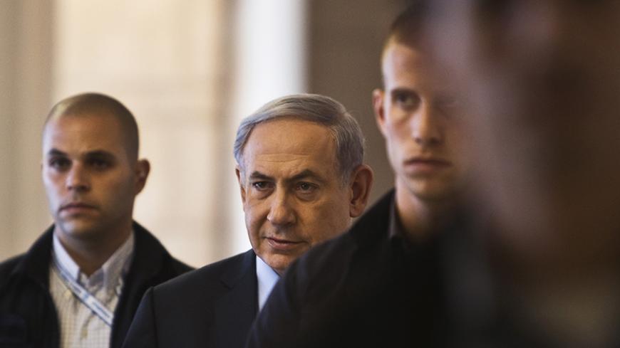 Israel's Prime Minister Benjamin Netanyahu (2nd L) arrives for a Likud party meeting at parliament in Jerusalem July 20, 2015. REUTERS/Nir Elias  - RTX1L1RF