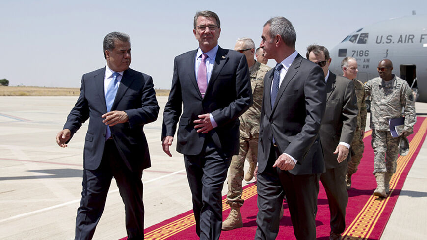 U.S. Defense Secretary Ash Carter (C) walks with Minister of Peshmerga, Mustafa Sayid Qadir (R) and Falah Mustafa, Kurdistan Regional Government Minister of Foreign Relations (L) as he arrives in Erbil, Iraq July 24, 2015. Carter arrived on an unannounced visit on Friday to Erbil, capital of Iraq's Kurdistan region whose forces have emerged as one of America's strongest partners in the fight against Islamic State. REUTERS/Carolyn Kaster/Pool - RTX1LME5