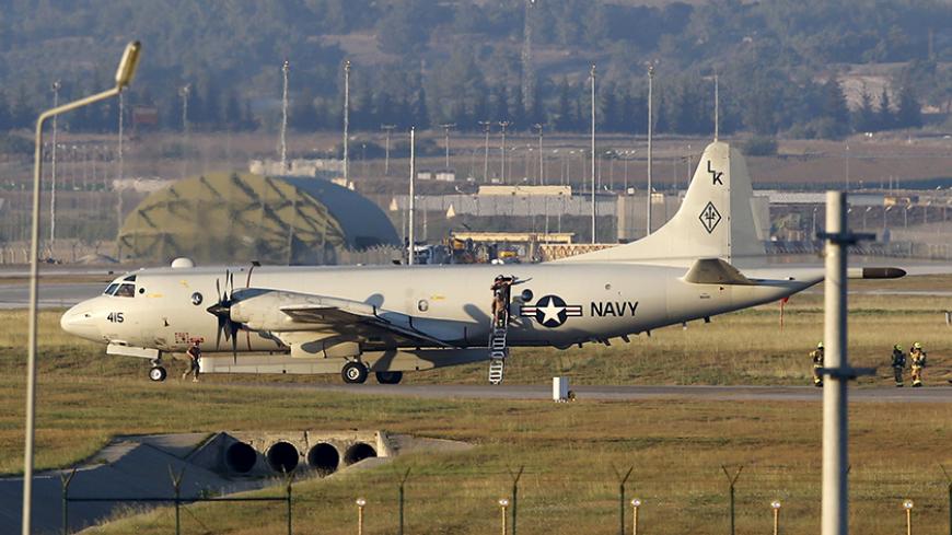 Crew members leave from a U.S. Navy P-3 Orion Maritime patrol aircraft after it landed at Incirlik airbase in the southern city of Adana, Turkey, July 25, 2015. REUTERS/Murad Sezer  - RTX1LSLM