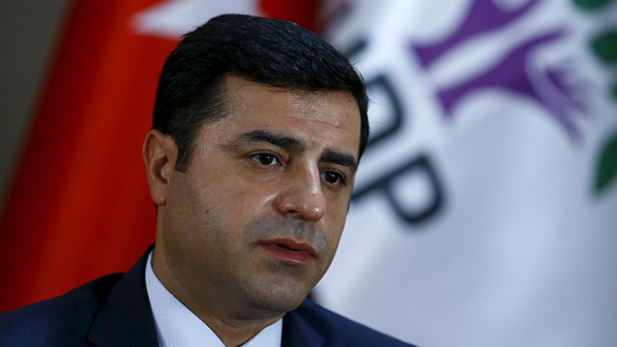 The leader of Turkey's pro-Kurdish opposition Peoples' Democratic Party (HDP) Selahattin Demirtas answers a question during an interview with Reuters in Ankara, Turkey, July 30, 2015. The main aim of Turkey's recent military operations in northern Syria is to prevent Kurdish territorial unity and not to combat Islamic State, the leader of Turkey's pro-Kurdish opposition HDP said on Thursday. Demirtas told Reuters in an interview that the ruling AK Party was dragging the country into conflict in revenge for 