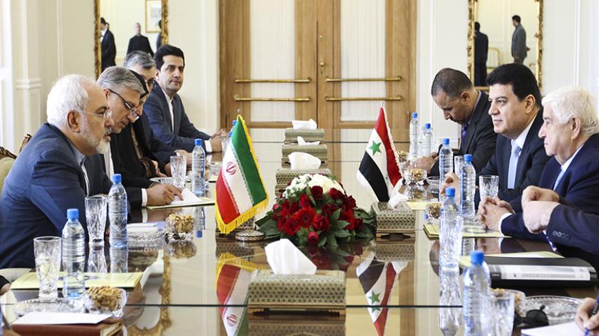 Iranian Foreign Minister Mohammad Javad Zarif (L) and his Syrian counterpart Walid al-Moualem (3rd R) hold a meeting in Tehran August 5, 2015. Syrian Foreign Minister Walid al-Moualem arrived in Tehran on Tuesday for talks with officials from allies Iran and Russia that are expected to focus on efforts to end the civil war in his country. REUTERS/Raheb Homavandi/TIMA ATTENTION EDITORS - THIS PICTURE WAS PROVIDED BY A THIRD PARTY. REUTERS IS UNABLE TO INDEPENDENTLY VERIFY THE AUTHENTICITY, CONTENT, LOCATION 