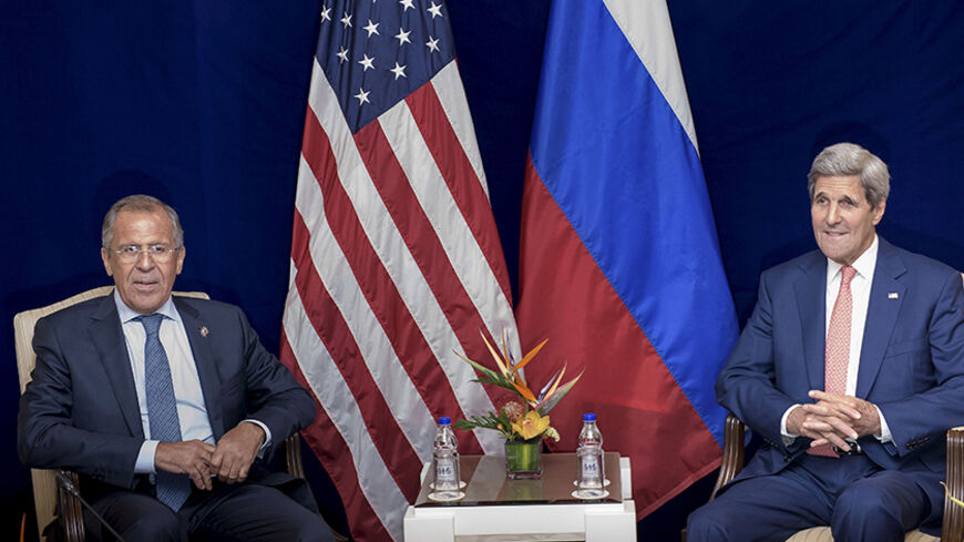 Russia's Foreign Minister Sergei Lavrov (L) and U.S. Secretary of State John Kerry sit next to each other before a bilateral meeting in Kuala Lumpur, Malaysia August 5, 2015. Kerry met for a second time in three days on Wednesday with Lavrov, who has been trying to bring about a rapprochement between Syria and regional states to forge an alliance to fight Islamic State militants.   REUTERS/Brendan Smialowski/Pool - RTX1N53V