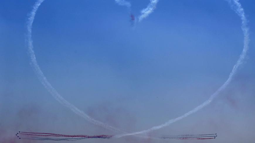 Egyptian air force planes trace a heart during the inauguration ceremony of the new Suez Canal, in Ismailia, Egypt, August 6, 2015. Egypt staged a show of international support on Thursday as it inaugurated a major extension of the Suez Canal which President Abdel Fattah al-Sisi hopes will power an economic turnaround in the Arab world's most populous country. REUTERS/Amr Abdallah Dalsh      TPX IMAGES OF THE DAY      - RTX1NCFA