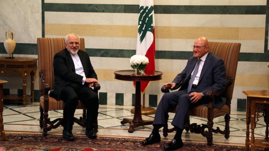 Iran's Foreign Minister Mohammad Javad Zarif (L) talks with Lebanon's Prime Minister Tammam Salam upon his arrival at the Government Palace in Beirut, Lebanon August 11, 2015. Zarif visits Lebanon for the first time since Iran reached an agreement with world powers on the country's nuclear program. REUTERS/Aziz Taher  - RTX1NXWG