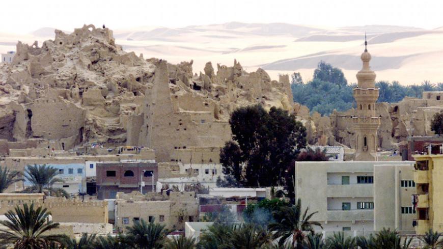 A view showing the 2,500-year-old ruins of Shally, the old city
standing above the new city known as Siwa, at the edge of the western
desert February 4, 2002. The oasis has about 230 hot and cold mainly
fresh water springs, and several large lakes scattered around the area,
which is a popular destination for tourists on desert safari trips.
REUTERS/Aladin Abdel Naby

AN/WS - RTR1849