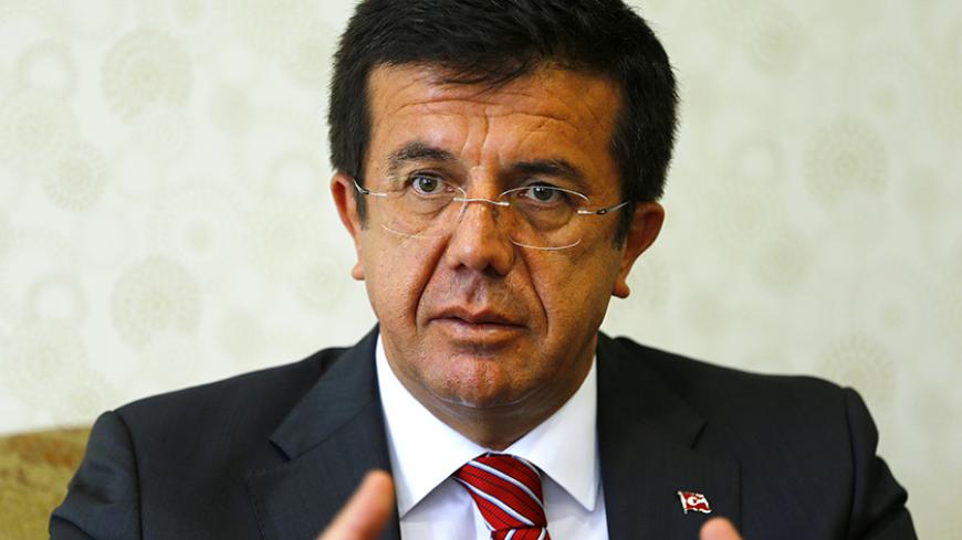 Turkey's Economy Minister Nihat Zeybekci speaks during an interview with Reuters in Ankara August 11, 2014. Turkey's government will maintain its calls for lower interest rates following Prime Minister Tayyip Erdogan's victory in the country's first direct presidential election, the economy minister said on Monday. Zeybekci told Reuters in an interview that the central bank's core mandate for price stability should be expanded to include employment and growth, although he added this would not be a top prior