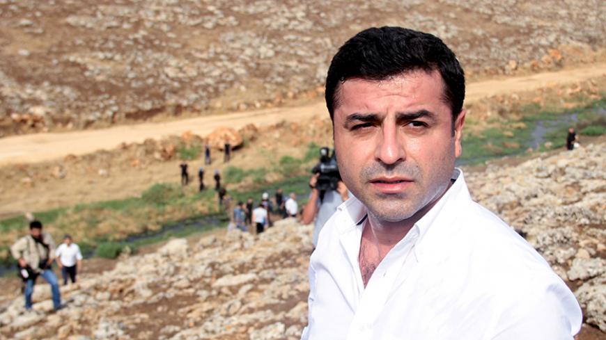 Co-chairman of the pro-Kurdish Peoples' Democratic Party, Selahattin Demirtas walks with his party members to the southeastern town of Cizre, near Idil in Sirnak province, Turkey, September 10, 2015. Pro-Kurdish politicians, including cabinet ministers, attempted to march to a town in southeast Turkey on Thursday to protest a week-old curfew there, as their party came under fire from President Tayyip Erdogan and from a court investigation of their leader. Conflict between militants of the Kurdistan Workers 