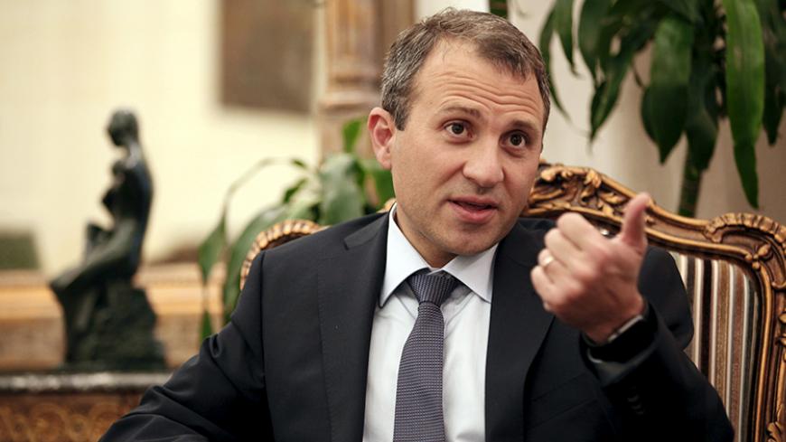 Lebanon's Foreign Minister Gebran Bassil talks during an interview with Reuters at his office in Beirut September 10, 2015. Arab countries should share the burden in supporting and hosting Syrian refugees, Bassil said on Thursday, highlighting the pressure a growing crisis has put on Syria's immediate neighbours. REUTERS/Jamal Saidi - RTSIRQ