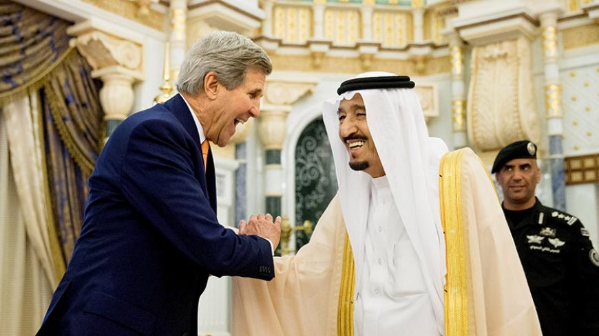 U.S. Secretary of State John Kerry, left, shakes hands with Saudi Arabia's King Salman at the Royal Court, in Riyadh, Saudi Arabia, Thursday, May 7, 2015. REUTERS/Andrew Harnik/Pool - RTX1BXMV