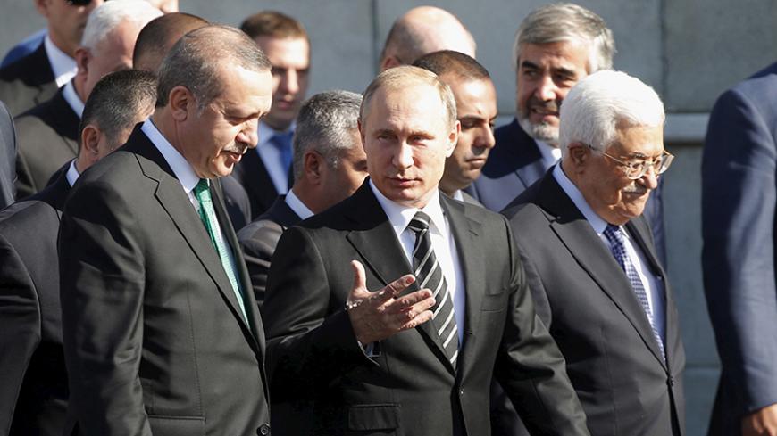(R-L) Palestinian President Mahmoud Abbas, Russian President Vladimir Putin and Turkish President Tayyip Erdogan walk to attend a ceremony to open the Moscow Grand Mosque in Moscow, Russia, September 23, 2015. The new mosque, which was erected on the site of the city's original mosque built in 1904 and which has been under reconstruction since 2005, will be able to accommodate up to 10,000 people simultaneously, according to local media. REUTERS/Maxim Shemetov - RTX1RZOH