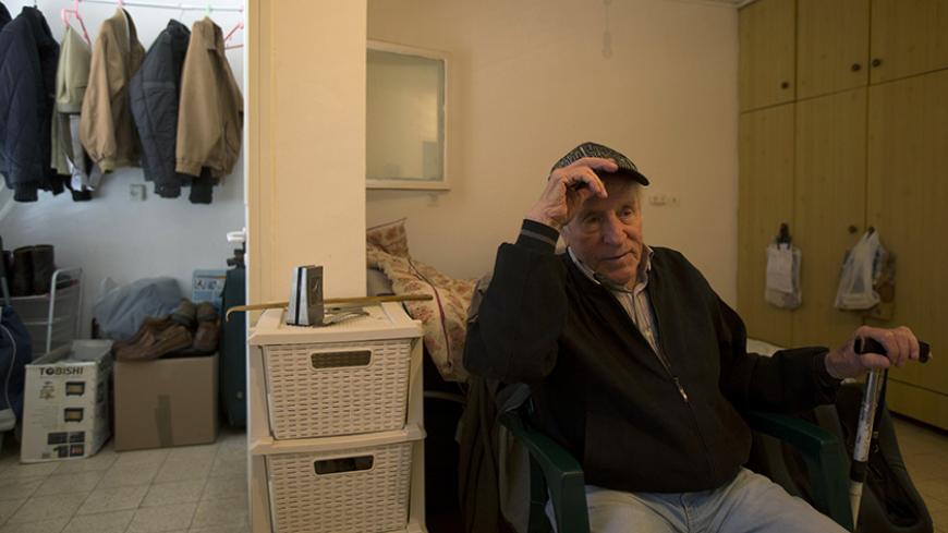 Transylvania-born Holocaust survivor Dov Yaacobovich, 84, sits in his home in Tel Aviv April 3, 2013. Some 192,000 Holocaust survivors live in Israel and about a third have sought aid from the Foundation for the Benefit of the Holocaust Victims in Israel. According to surveys by the foundation, 19 percent of the survivors have admitted to going without adequate amounts of food and 14 percent had to forego medical treatment at least once a year due to financial hardship. The report said that another severe c