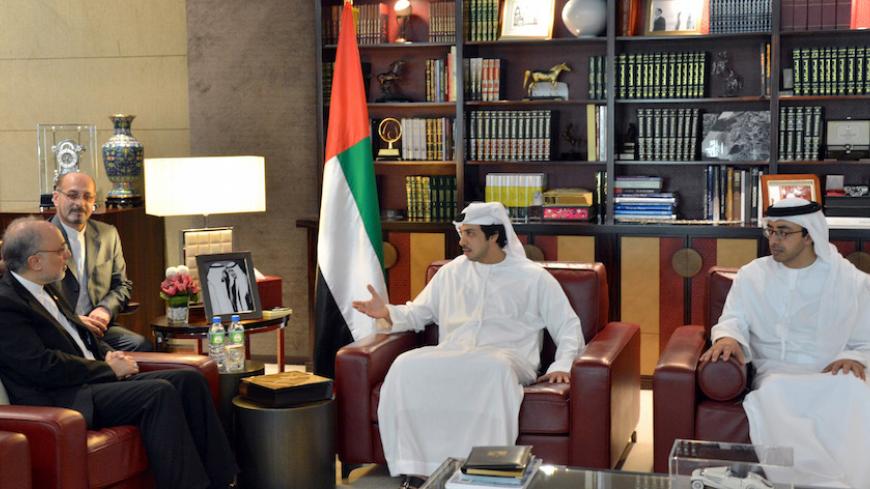 Iranian Foreign Minister Ali Akbar Salehi (L) meets with UAE Foreign Affairs Minister Sheikh Abdullah Bin Zayed Al Nahyan (R) and brother Sheikh Mansour bin Zayed Al Nahyan in Abu Dhabi in this handout picture released by Emirates News Agency WAM July 9, 2012. REUTERS/WAM/Handout (UNITED ARAB EMIRATES - Tags: POLITICS) FOR EDITORIAL USE ONLY. NOT FOR SALE FOR MARKETING OR ADVERTISING CAMPAIGNS. THIS IMAGE HAS BEEN SUPPLIED BY A THIRD PARTY. IT IS DISTRIBUTED, EXACTLY AS RECEIVED BY REUTERS, AS A SERVICE TO 
