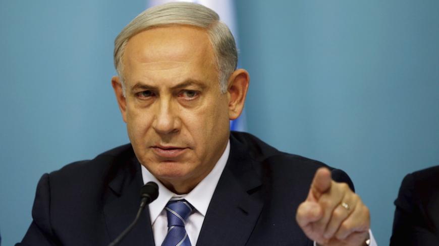 Israel's Prime Minister Benjamin Netanyahu gestures as he speaks during a news conference in Jerusalem October 8, 2015. Four people, including an Israeli soldier, were stabbed and wounded near a military headquarters in Tel Aviv on Thursday, police and ambulance sources said, as a rash of such Palestinian attacks spread to Israel's commercial capital. The assailant was shot and killed by another soldier as he fled, a police spokeswoman said. REUTERS/Ronen Zvulun - RTS3M2L