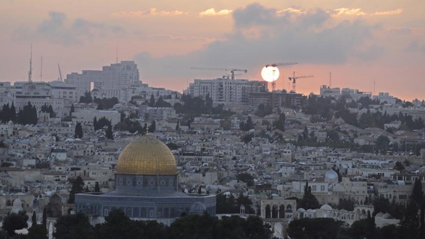 The Dome of the Rock (L) located on the compound known to Muslims as Noble Sanctuary and to Jews as Temple Mount in Jerusalemís Old City is seen during sunset May 29, 2015. Picture taken May 29, 2015. REUTERS/Ammar Awad   - RTX1F3SU