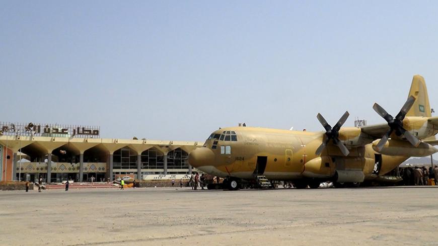 A Saudi military cargo plane is seen at the international airport of Yemen's southern port city of Aden July 22, 2015. A Saudi military plane loaded with arms for fighters loyal to Yemen's deposed president landed at Aden airport on Wednesday, an airport official said, the first flight to reach the embattled port city in four months. REUTERS/Stringer - RTX1LEI9