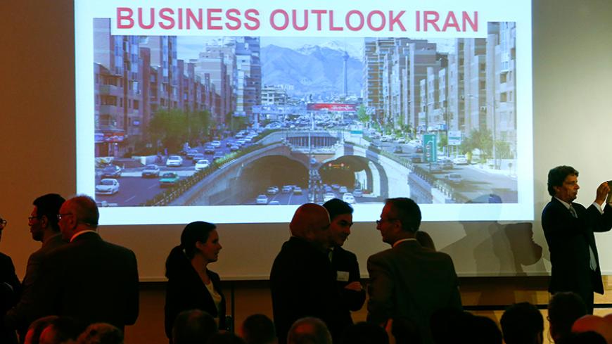 Participants await the start of an event hosted by Swiss government-funded organization Swiss Global Enterprise, in Zurich, Switzerland August 27, 2015. Swiss Global Enterprise, who promotes small Swiss businesses abroad, is hosting an event on how to pursue opportunities in Iran following the nuclear agreement in June.  REUTERS/Arnd Wiegmann  - RTX1PUMW