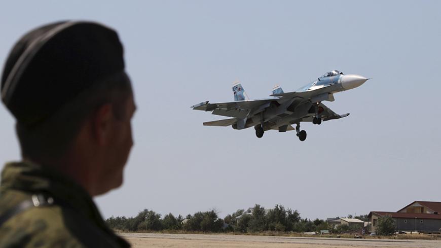 A Russian SU-33 naval fighter plane flies during a drill at the Nitka training complex in the village of Novofedorovka, west of the Crimean city of Simferopol, August 27, 2015. Pilots of Russian Navy's Northern Fleet's deck-based aviation are taking part in a military exercise in the Crimea.  REUTERS/Pavel Rebrov - RTX1PWT1