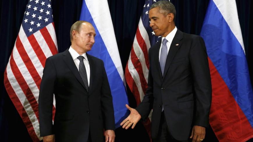 U.S. President Barack Obama extends his hand to Russian President Vladimir Putin during their meeting at the United Nations General Assembly in New York September 28, 2015. REUTERS/Kevin Lamarque  - RTX1SYBB