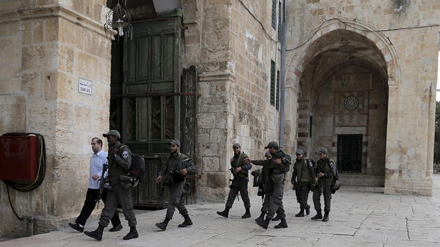 Israeli paramilitary police walk on the compound known to Muslims as the Noble Sanctuary and to Jews as Temple Mount in Jerusalem's Old City October 26, 2015. Monday's visit to the compound was low-key by most standards - no fighting broke out, no one was ejected by the police, everyone left calmly and life returned to normal. But in critical ways it cut to the heart of an issue fuelling the worst violence between Palestinians and Israel in years: whether the status quo at the site, also known as the Al-Aqs