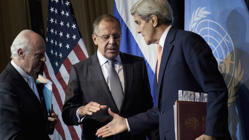 UN Special Envoy for Syria Staffan de Mistura (L) watches as Russian Foreign Minister Sergei Lavrov (C) and US Secretary of State John Kerry shake hands after a news conference at the Grand Hotel, in Vienna, October 30, 2015. U.S. Secretary of State John Kerry said on Friday he hoped progress could be made at international talks in Vienna aimed at finding a political solution to Syria's four-year-old civil war but it would be very difficult. REUTERS/Brendan Smialowski/Pool - RTX1U16S