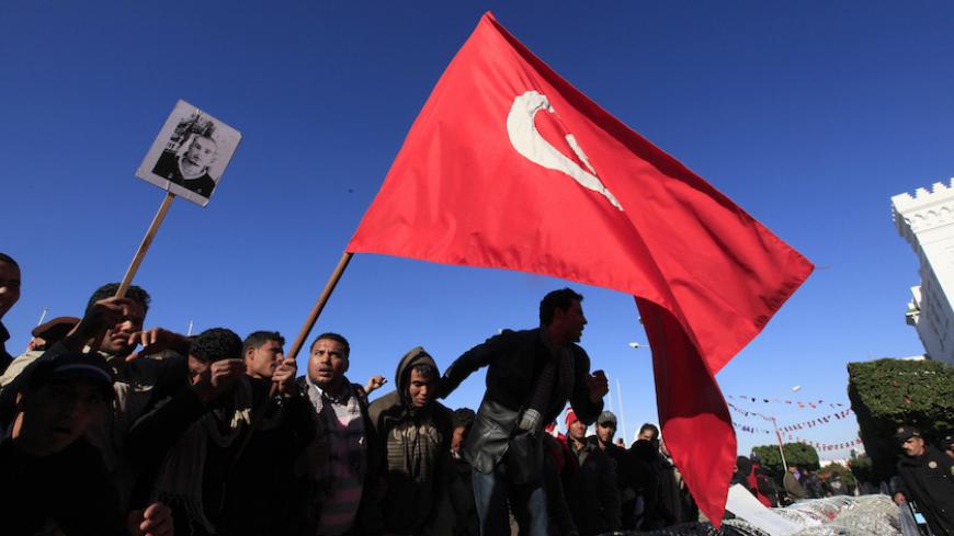 Protesters from Tunisia's poor rural heartlands chant slogans during a demonstration by the Prime Minister's office in Tunis January 23, 2011. Protesters from Tunisia's poor rural heartlands demonstrated in the capital on Sunday to demand that the revolution they started should now sweep the remnants of the fallen president's old guard from power. REUTERS/Zohra Bensemra (TUNISIA - Tags: POLITICS CIVIL UNREST) - RTXWYQW