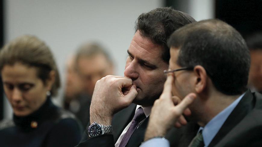 Israel's Ambassador to the U.S. Ron Dermer (2nd R) attends a forum with Prime Minister Benjamin Netanyahu (not pictured) hosted by the Center for American Progress in Washington November 10, 2015. Israeli Prime Minister Benjamin Netanyahu assured U.S. President Barack Obama on Monday that he remained committed to a two-state solution to the Israeli-Palestinian conflict as they sought to mend ties strained by acrimony over Middle East diplomacy and Iran. REUTERS/Jonathan Ernst - RTS6DLP