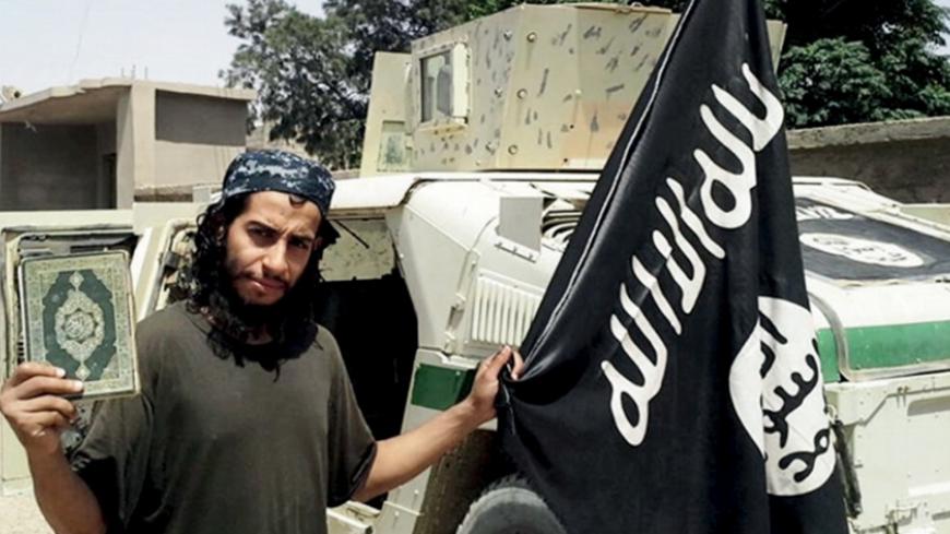 An undated photograph of a man described as Abdelhamid Abaaoud that was published in the Islamic State's online magazine Dabiq and posted on a social media website. A Belgian national currently in Syria and believed to be one of Islamic State's most active operators is suspected of being behind Friday's attacks in Paris, acccording to a source close to the French investigation. "He appears to be the brains behind several planned attacks in Europe," the source told Reuters of Abdelhamid Abaaoud, adding he wa
