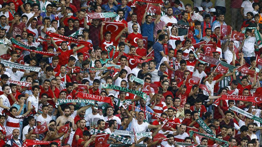 Turkish soccer fans cheer before the Euro 2016 Group A qualifying soccer match between Turkey and the Netherlands in Konya, Turkey, September 6, 2015.  REUTERS/Umit Bektas  - RTX1RCR3