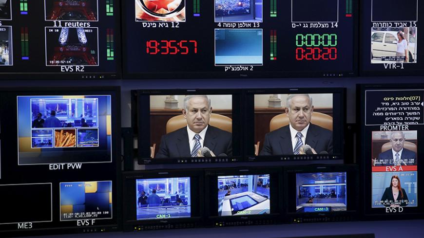 Israel's Prime Minister Benjamin Netanyahu is seen on monitors before the evening news bulletin at Channel 10's control room in Jerusalem November 18, 2015. Critics say Netanyahu, known as "Bibi," is hitting the wrong note when it comes to the media, weakening press freedom and holding sway over TV broadcasters in a country that bills itself as the Middle East's only true democracy. Picture taken November 18, 2015. To match Insight ISRAEL-NETANYAHU/MEDIA  REUTERS/Ronen Zvulun  - RTX1VG1F