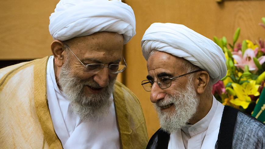EDITORS' NOTE:  Reuters and other foreign media are subject to Iranian restrictions on their ability to film or take pictures in Tehran.
Ayatollah Mohammad Reza Mahdavi Kani (L) speaks with Guardian Council Chief Ayatollah Ahmad Jannati during a conference in Tehran in this August 14, 2008 file photo. Arch hardliner Mahdavi-Kani was elected and confirmed as head of Iran's Assembly of Experts on March 8, 2011. REUTERS/Raheb Homavandi  (IRAN - Tags: POLITICS) - RTR2JNJ9