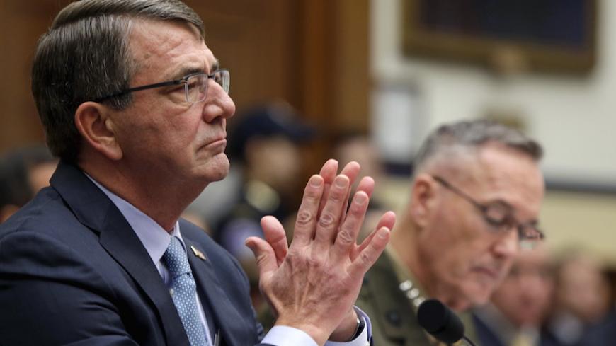  U.S. Defense Secretary Ash Carter (L) and Joint Chiefs Chairman Marine Corps Gen. Joseph Dunford Jr., testify before a House Armed Services Committee hearing on "U.S. Strategy for Syria and Iraq and its Implications for the Region." in Washington December 1, 2015.   REUTERS/Gary Cameron     - RTX1WOT9