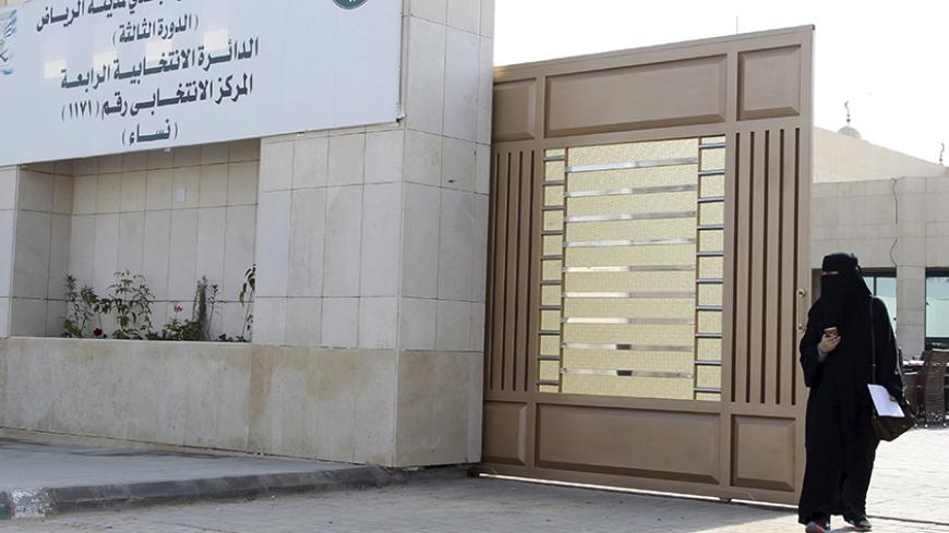 A woman leaves a polling station after casting her vote during municipal elections, in Riyadh, Saudi Arabia December 12, 2015. REUTERS/Faisal Al Nasser - RTX1YCBD