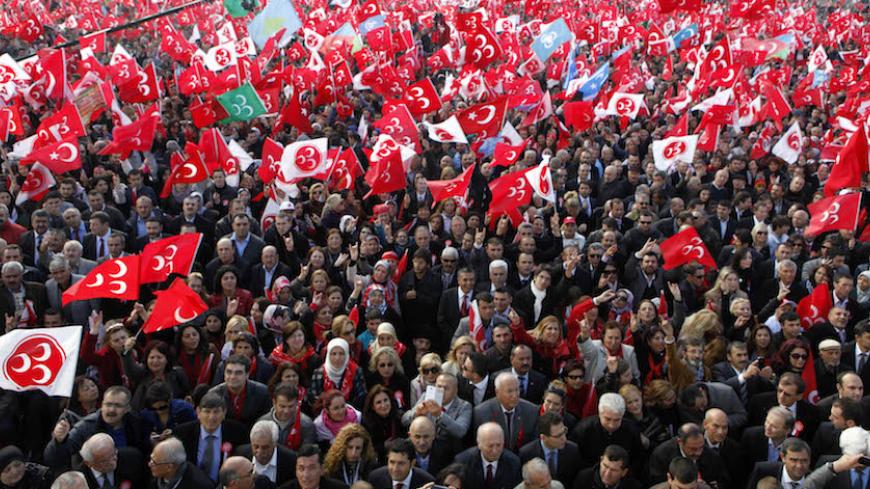 Supporters of the Nationalist Movement Party (MHP) make the grey wolf sign of the party as they wait for the arrival of party leader Devlet Bahceli during a rally in Istanbul October 5, 2013. REUTERS/Osman Orsal (TURKEY - Tags: POLITICS) - RTR3FMJT