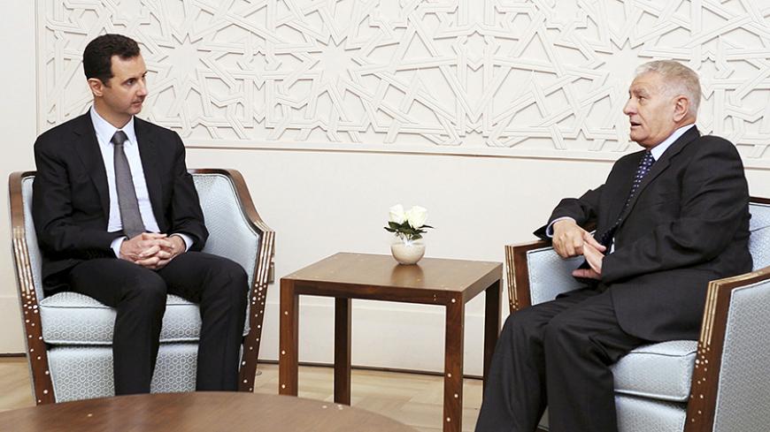 Syria's President Bashar al-Assad (L) meets Abbas Zaki, the personal envoy of the Palestinian President Mahmoud Abbas, in Damascus, in this handout photograph distributed by Syria's national news agency SANA on October 7, 2013.  REUTERS/SANA/Handout via Reuters (SYRIA - Tags: POLITICS) ATTENTION EDITORS - THIS IMAGE WAS PROVIDED BY A THIRD PARTY. FOR EDITORIAL USE ONLY. NOT FOR SALE FOR MARKETING OR ADVERTISING CAMPAIGNS. THIS PICTURE IS DISTRIBUTED EXACTLY AS RECEIVED BY REUTERS, AS A SERVICE TO CLIENTS - 