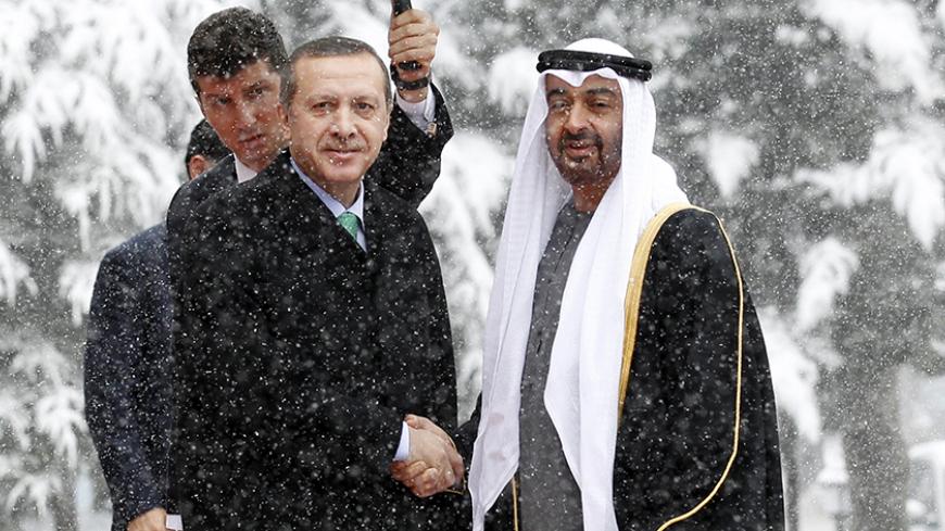 Abu Dhabi's Crown Prince Sheikh Mohammed bin Zayed Al Nahyan (R) is welcomed by Turkey's Prime Minister Recep Tayyip Erdogan as he arrives for a meeting in Ankara February 28, 2012. REUTERS/Umit Bektas (TURKEY - Tags: POLITICS ENVIRONMENT) - RTR2YKVT