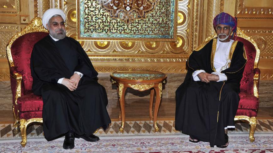 Oman's Sultan Qaboos bin Said (R) meets with Iran's President Hassan Rouhani in Muscat March 12, 2014. REUTERS/Sultan Al Hasani (OMAN - Tags: POLITICS ROYALS) - RTR3GQ5T