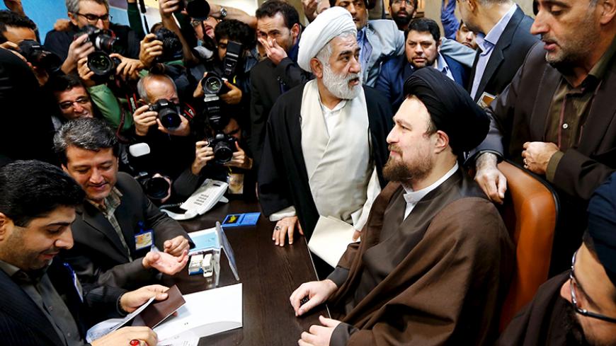 Hassan Khomeini (C, in chair), 43, a grandson of Iran's Ayatollah Ruhollah Khomeini, registers for February's election of the Assembly of Experts, the clerical body that chooses the supreme leader, at the Interior Ministry in Tehran December 18, 2015. REUTERS/TIMA  ATTENTION EDITORS - THIS IMAGE WAS PROVIDED BY A THIRD PARTY. FOR EDITORIAL USE ONLY.  - RTX1Z8MD