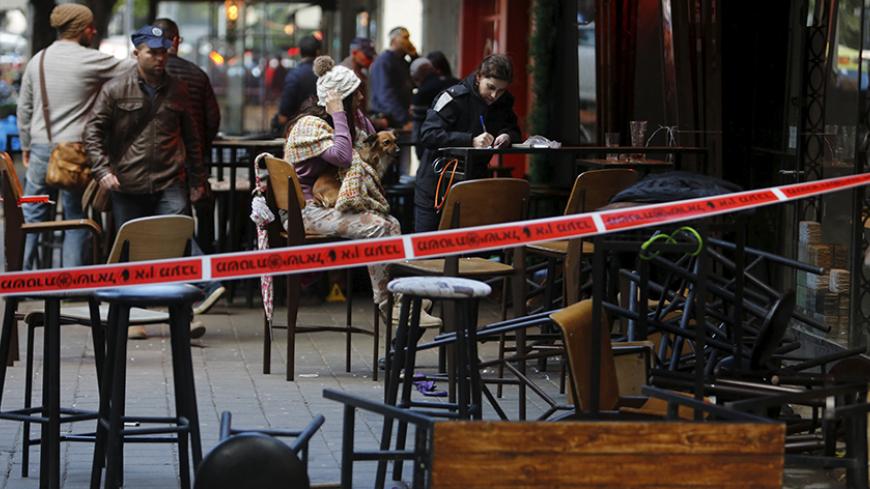 A police cordon is seen near the scene of a shooting incident in Tel Aviv, Israel January 1, 2016. A gunman killed two people and wounded at least three others in central Tel Aviv on Friday before fleeing, Israeli police said, adding that the motive for the attack was unclear. REUTERS/Nir Elias - RTX20PWU