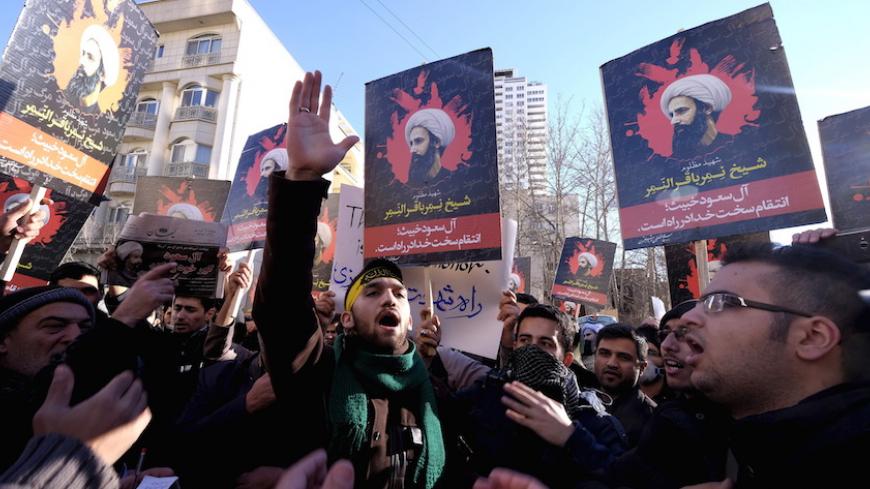 Iranian protesters chant slogans as they hold pictures of Shi'ite cleric Sheikh Nimr al-Nimr during a demonstration against the execution of Nimr in Saudi Arabia, outside the Saudi Arabian Embassy in Tehran January, 3, 2016. REUTERS/Raheb Homavandi/TIMA  ATTENTION EDITORS - THIS IMAGE WAS PROVIDED BY A THIRD PARTY. FOR EDITORIAL USE ONLY.  - RTX20VH0