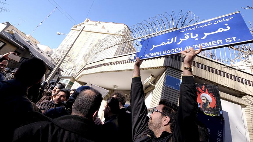 An Iranian protester holds up a street sign with the name of Shi'ite cleric Sheikh Nimr al-Nimr during a demonstration against the execution of Nimr in Saudi Arabia, outside the Saudi Arabian Embassy in Tehran January, 3, 2016. REUTERS/Raheb Homavandi/TIMA  ATTENTION EDITORS - THIS IMAGE WAS PROVIDED BY A THIRD PARTY. FOR EDITORIAL USE ONLY.       TPX IMAGES OF THE DAY      - RTX20VLE