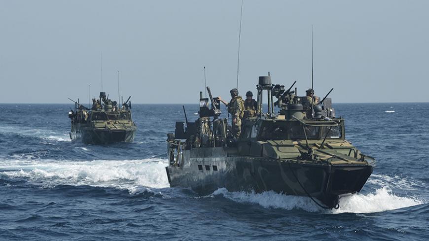 Riverine command boats assigned to Coastal Riverine Squadron (RIVRON) 4, transit open water in the 5th fleet area of responsibilities in this June 27, 2013 handout photo provided by the U.S. Navy, January 12, 2016. Ten sailors aboard two U.S. Navy riverine patrol boats were seized by Iran in the Gulf on Tuesday, and Tehran told the United State the crew members would be promptly returned, according to U.S. Officials. REUTERS/Mass Communication Specialist 1st Class Peter Lewis/U.S. Navy/Handout via Reuters -