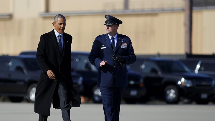 U.S. President Barack Obama walks to boards Air Force One for Nebraska and Louisiana, after a short meeting with Jordan's King Abdullah at Joint Base Andrews in Maryland, January 13, 2016. REUTERS/Carlos Barria - RTX2293H